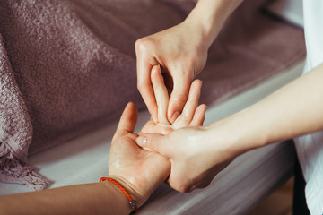 physical therapist massaging hands