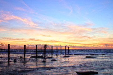 Fototapeta na wymiar background of beach and sea at sunset colors.
