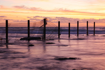 Obraz premium background of beach and sea at sunset colors.