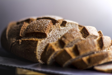 Sliced rye bread on cutting board closeup