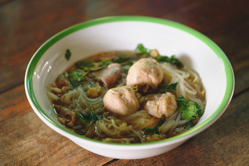 Noodle and soup in bowl put on the table