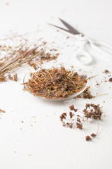The dried herb oregano on a white table