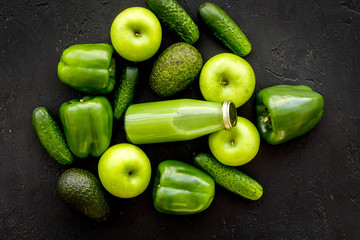 Fitness greeny drink with vegetables on dark background top view mock-up