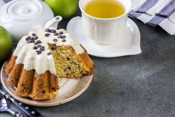 Glazed fresh cake on a round wooden stand