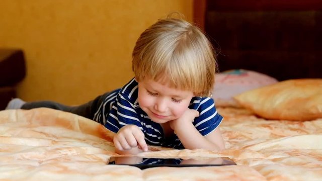 Little boy Playing with Tablet