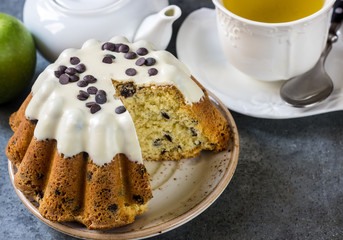 Glazed fresh cake on a round wooden stand