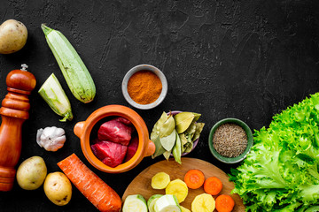 ingredients for vegetable ragout cooking on stone table background top view mock-up