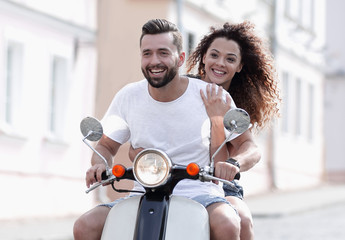 Cool man and beautiful girl riding on  scooter with  expression © ASDF