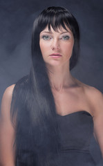 Fototapeta premium mysterious portrait of a girl in the dark, in the fog