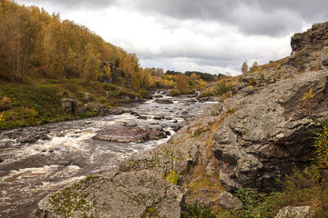 Fototapeta na wymiar Mountain river, rapids, rocks in the water