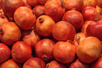 A pile of pomegranates in store as background, texture
