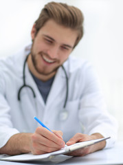 background image of a doctor writing out a prescription