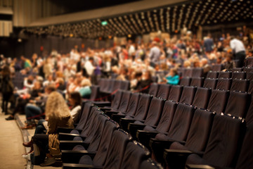 empty rows of theater seats in large hall
