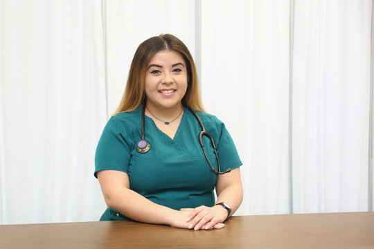 Portrait of a female hispanic healthcare professional, woman nurse
