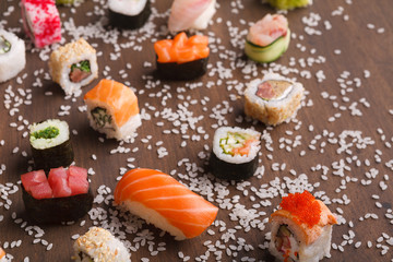 Assortment of colorful sushi and rolls background