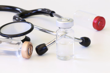 stethoscope with vaccine vials © monropic
