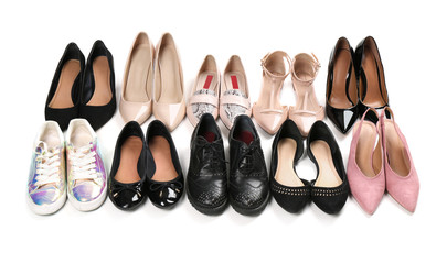Various female stylish shoes on white background