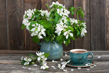 Still life with tea cup and  spring blossom flowers