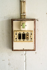 Old vintage switches in the wall wooden box