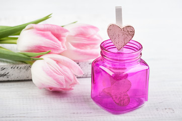Pink bottle with wooden hearts