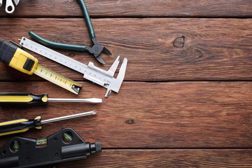 Repair tools on wood background with copy space