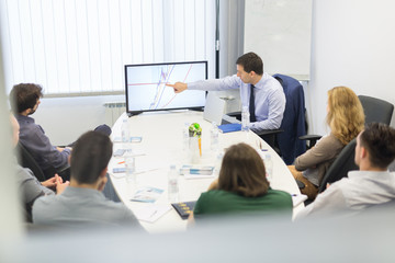 Business man making a presentation at office. Business executive delivering a presentation to his...