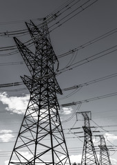  high-voltage  power lines at storm clouds.