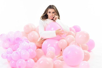 Obraz na płótnie Canvas Young woman with colorful balloon. Woman laying with balloons. Pyjama party. Beautiful girl with long hair posing with balloons. Party mood. Gorgeous trendy young woman laying in pink balloon.