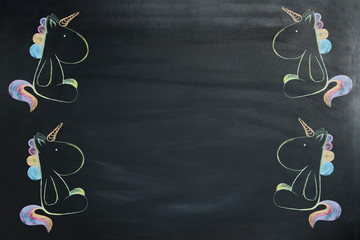 A colored unicorn painted chalk on a blackboard.