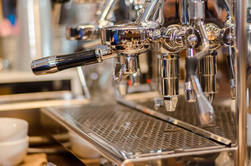 coffee machine. coffee machine preparing fresh coffee and pouring into cups at restaurant, bar or pub.