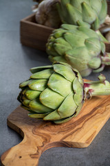 Fototapeta premium Green ripe raw artichokes ready to cook