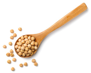 dried chickpeas in the wooden spoon, isolated on white, top view