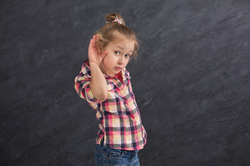 Little girl trying to hear something