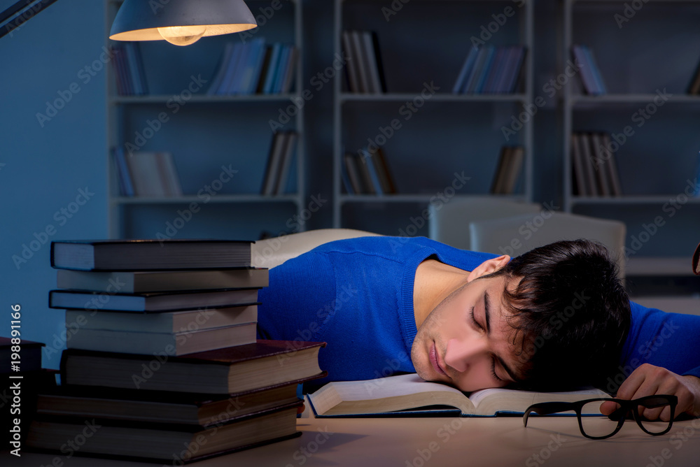 Sticker student preparing for exams late at night in library