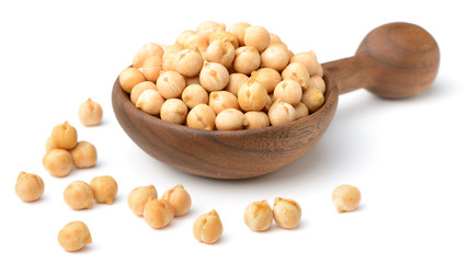 dried chickpeas in the wooden spoon, isolated on white