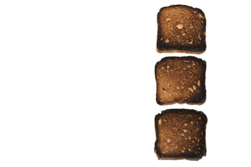 Burned bread with seeds located vertically isolated on a white background