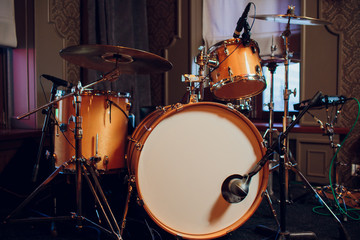 Modern drum set on stage prepared for playing.