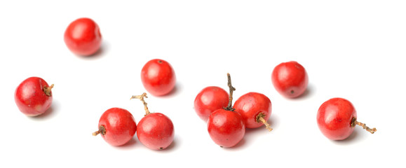 closeup of dried pink peppercorns isolated on white - Powered by Adobe