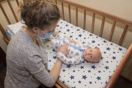 Mom, Who Is Ill, Keeps Her Baby In A Protective Medical Mask