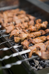 Grilling shashlik on barbecue grill, only pork.