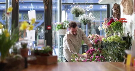 Male Florist working in store