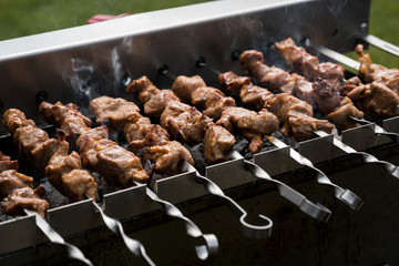 Grilling shashlik on barbecue grill, only pork.