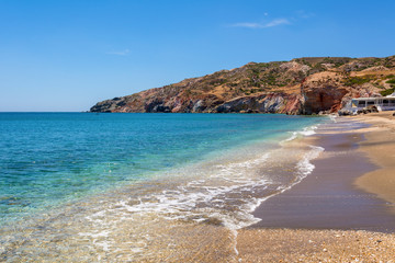 Beach with crystal sea water in Paleochori bay on Milos island in Greece.