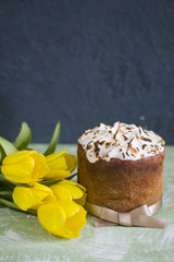 Vertically background with Easter’s cake and yellow tulip