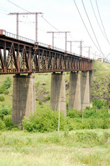High iron bridge on concrete supports