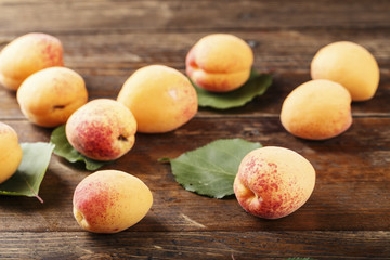 Apricots. Ripe fresh apricots on a wooden white background, top view