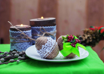 Eggs and willow twigs and candles. Concept of Easter Easter, holiday, greetings, Christianity.