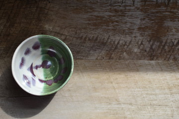 pottery bowl green white and raspberry overhead view