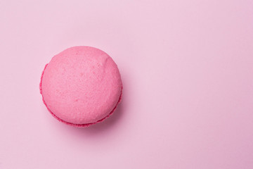 pink makroon on a pink background, stylish image, concept