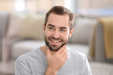 Obraz premium Portrait of young man with beautiful hair indoors